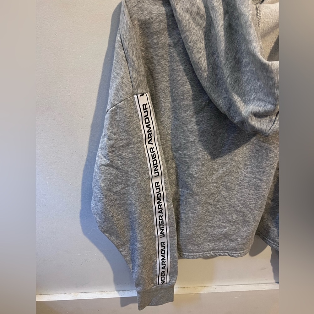 Under armor gray hoodie. Logo down the side
